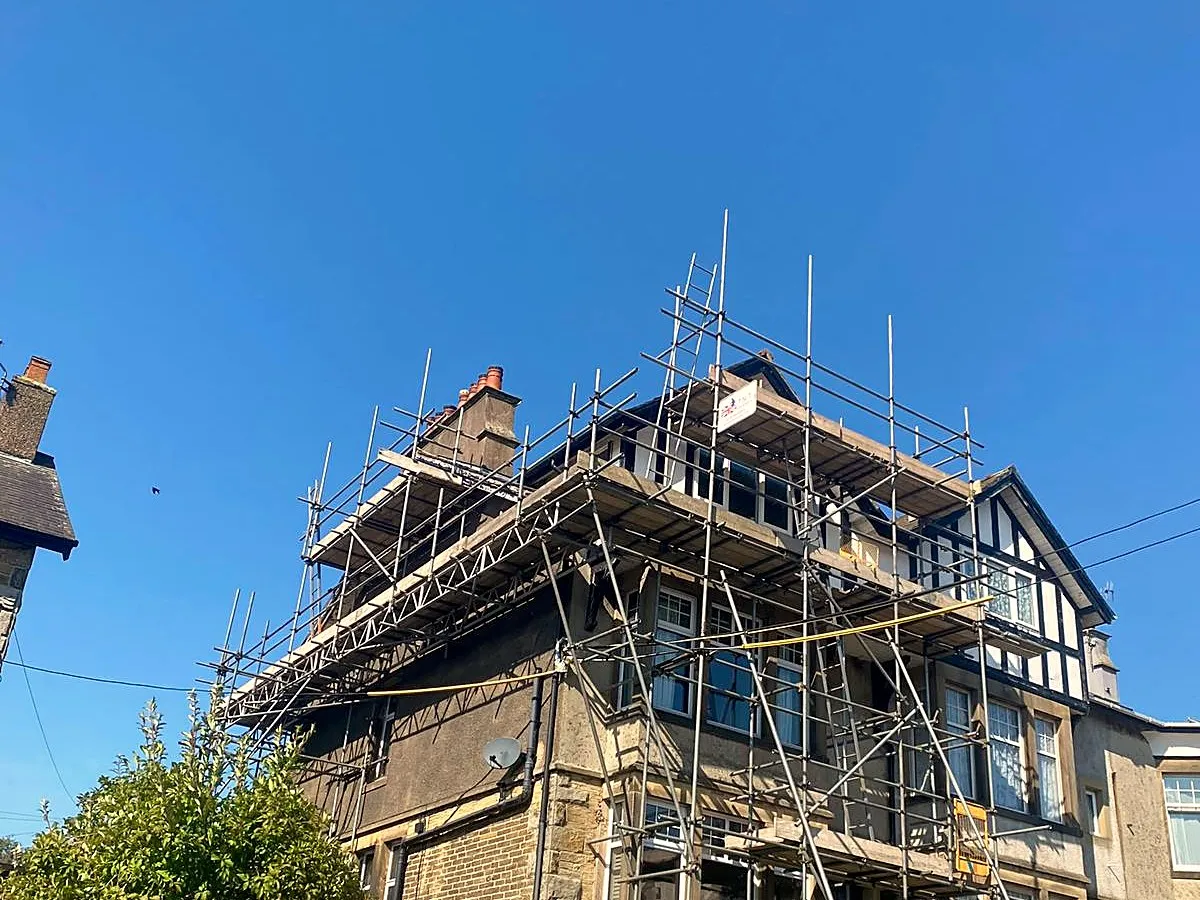 Scaffold access to roof level on a stone property