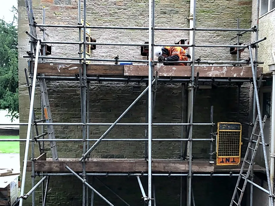 Scaffold and structural access on a stone building
