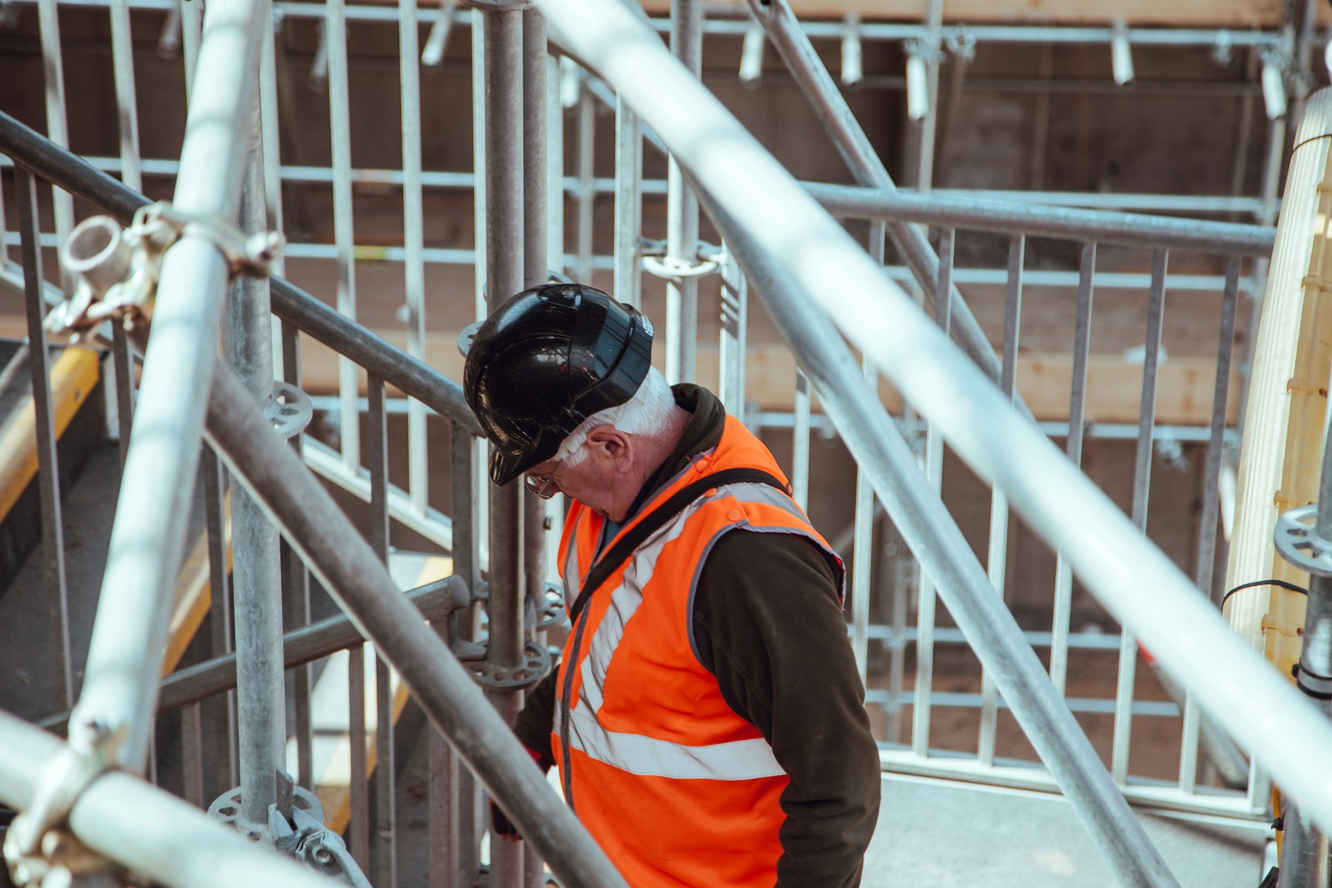 Scaffolder working safely on a boarded platform
